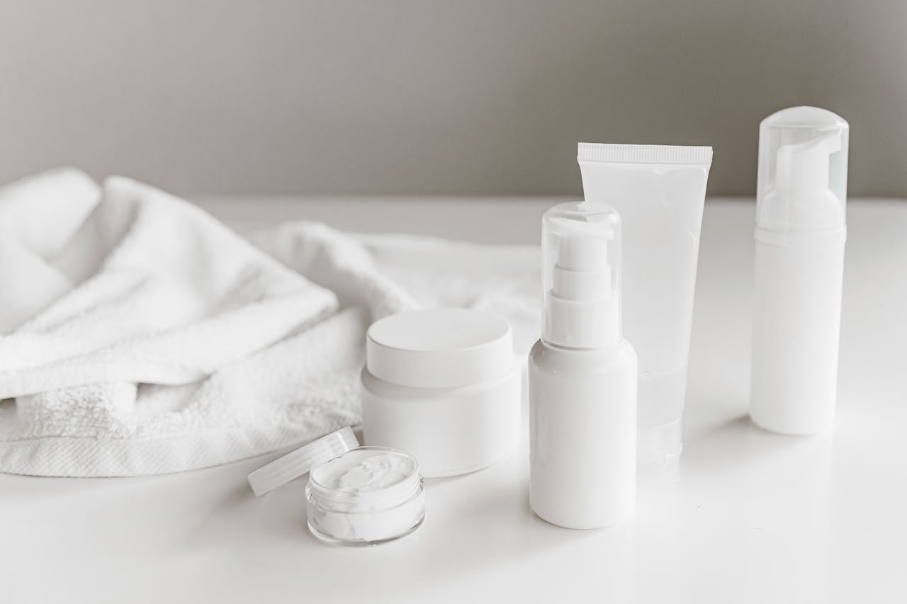 Mastering the First Impression: Your intriguing post title goes here Clean and stylish display of skincare products on a white surface with a towel backdrop.